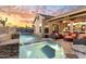 Inviting backyard oasis featuring a pool, spa, and comfortable seating for outdoor relaxation and enjoyment at 11053 E Hedgehog Pl, Scottsdale, AZ 85262