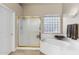 Bathroom features separate tub and shower with a private window at 11053 E Hedgehog Pl, Scottsdale, AZ 85262