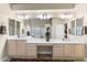 Bright bathroom featuring dual sinks, a large mirror, and modern fixtures at 11053 E Hedgehog Pl, Scottsdale, AZ 85262