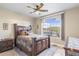 Comfortable bedroom showcasing a dark wood bed frame and a view of the desert landscape at 11053 E Hedgehog Pl, Scottsdale, AZ 85262