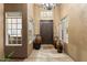 Elegant entryway with decorative vases and large windows, creating a welcoming atmosphere at 11053 E Hedgehog Pl, Scottsdale, AZ 85262