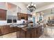 Spacious kitchen with stainless steel appliances, granite countertops, and a large kitchen island at 11053 E Hedgehog Pl, Scottsdale, AZ 85262