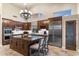 Spacious kitchen with stainless steel appliances, granite countertops, and a large kitchen island at 11053 E Hedgehog Pl, Scottsdale, AZ 85262
