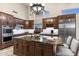 This kitchen features a large island, stainless steel appliances and custom cabinets at 11053 E Hedgehog Pl, Scottsdale, AZ 85262