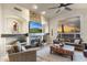 Inviting living room with stone fireplace, beamed shelves and scenic views at 11053 E Hedgehog Pl, Scottsdale, AZ 85262