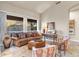 Inviting living room with cozy seating, earth-toned decor, and a view of the surrounding desert landscape at 11053 E Hedgehog Pl, Scottsdale, AZ 85262