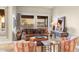 Inviting living room with cozy seating, earth-toned decor, and a view of the surrounding desert landscape at 11053 E Hedgehog Pl, Scottsdale, AZ 85262