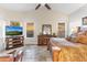 Spacious main bedroom featuring a comfortable bed, vaulted ceilings, and a television for entertainment at 11053 E Hedgehog Pl, Scottsdale, AZ 85262