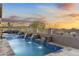 Resort-style pool with desert views and built-in water features at 11053 E Hedgehog Pl, Scottsdale, AZ 85262