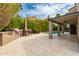 Backyard featuring covered patio, outdoor kitchen, barbeque, and swimming pool at 1210 E Azure Sea Ln, Gilbert, AZ 85234