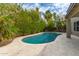 Backyard featuring a swimming pool with desert landscaping at 1210 E Azure Sea Ln, Gilbert, AZ 85234