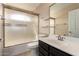 This bathroom features a combination tub shower, toilet and single sink vanity at 1210 E Azure Sea Ln, Gilbert, AZ 85234