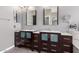 Elegant bathroom featuring dual vanities, modern fixtures, and contemporary mirrors at 1210 E Azure Sea Ln, Gilbert, AZ 85234