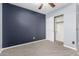 Another bedroom features a ceiling fan and a closet at 1210 E Azure Sea Ln, Gilbert, AZ 85234