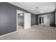 Cozy bedroom with neutral carpet, offering space and closet with mirrored doors at 1210 E Azure Sea Ln, Gilbert, AZ 85234