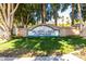 Val Vista Lakes Clubhouse sign surrounded by trees and lush green grass at 1210 E Azure Sea Ln, Gilbert, AZ 85234
