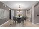 Cozy dining room with modern chandelier, neutral color scheme, and natural light at 1210 E Azure Sea Ln, Gilbert, AZ 85234