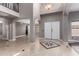 Elegant foyer with tile flooring and an attractive star tile design, complemented by neutral-toned walls at 1210 E Azure Sea Ln, Gilbert, AZ 85234