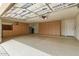 Spacious garage with epoxy floors and built-in storage cabinets and door to outside at 1210 E Azure Sea Ln, Gilbert, AZ 85234