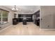 Eat-in kitchen features dark cabinets, a center island, and stainless steel appliances at 1210 E Azure Sea Ln, Gilbert, AZ 85234