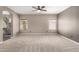 Spacious main bedroom with carpet floors, ample natural light, and ensuite bath promotes relaxation and comfort at 1210 E Azure Sea Ln, Gilbert, AZ 85234