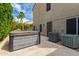 Backyard patio with hot tub and lush landscaping at 1210 E Azure Sea Ln, Gilbert, AZ 85234