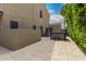 Paver patio with hot tub and adjacent to a neutral home exterior at 1210 E Azure Sea Ln, Gilbert, AZ 85234