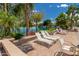Tranquil poolside with lounge chairs and serene lake views at 1210 E Azure Sea Ln, Gilbert, AZ 85234