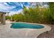 Beautiful backyard swimming pool with desert landscaping at 1210 E Azure Sea Ln, Gilbert, AZ 85234