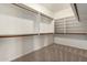 Spacious walk-in closet with ample shelving and hanging space for organized storage at 1210 E Azure Sea Ln, Gilbert, AZ 85234