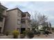 Exterior view of a well-maintained multi-story apartment building with private balconies and mature landscaping at 14000 N 94Th St # 3147, Scottsdale, AZ 85260