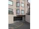 View of the garage with a secure roll-up gate and marked clearance height for vehicle entry at 14000 N 94Th St # 3147, Scottsdale, AZ 85260