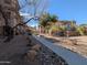 Picture of the community grounds and paved path with desert landscaping at 14000 N 94Th St # 3147, Scottsdale, AZ 85260
