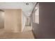Hallway featuring carpet, arched doorway, and access to other rooms at 14000 N 94Th St # 3147, Scottsdale, AZ 85260
