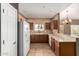 Bright kitchen with stainless steel appliances, wooden cabinets, and convenient breakfast bar at 14000 N 94Th St # 3147, Scottsdale, AZ 85260