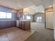 Open kitchen with tile floors, wood cabinets and modern appliances leading to a spacious living area at 14000 N 94Th St # 3147, Scottsdale, AZ 85260