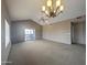 Bright living room featuring vaulted ceilings, a ceiling fan, and access to outdoor balcony at 14000 N 94Th St # 3147, Scottsdale, AZ 85260