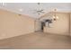 Spacious living area with vaulted ceilings and modern chandelier flowing into the kitchen at 14000 N 94Th St # 3147, Scottsdale, AZ 85260