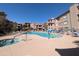 Community pool and lounge area for residents and guests on a sunny day at 14000 N 94Th St # 3147, Scottsdale, AZ 85260