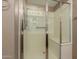 Shower stall with clear glass doors, built-in bench, and adjustable shower head at 14000 N 94Th St # 3147, Scottsdale, AZ 85260