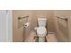 Close-up of a toilet with assist bars in a bathroom with tile flooring at 14000 N 94Th St # 3147, Scottsdale, AZ 85260