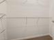 Empty walk-in closet with white walls and metal shelving at 14000 N 94Th St # 3147, Scottsdale, AZ 85260