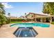 Expansive backyard featuring a pool, spa, and patio perfect for entertaining at 15027 N 61St Pl, Scottsdale, AZ 85254