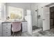 Bright bathroom featuring gray countertops, and a glass enclosed shower at 15027 N 61St Pl, Scottsdale, AZ 85254