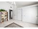 Spacious bedroom with three closets, carpet flooring, bookshelf, and white walls for a clean aesthetic at 15027 N 61St Pl, Scottsdale, AZ 85254