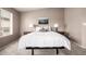 Neutral bedroom with a bed and two side tables with lamps at 15027 N 61St Pl, Scottsdale, AZ 85254