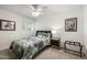 Bright bedroom featuring a bed with colorful patterned bedding at 15027 N 61St Pl, Scottsdale, AZ 85254