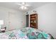 Bedroom features a bed with bookcase and views to additional rooms at 15027 N 61St Pl, Scottsdale, AZ 85254