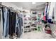 Walk-in closet featuring ample shelf and rod storage at 15027 N 61St Pl, Scottsdale, AZ 85254