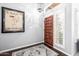 Entryway features stylish decor, wood flooring, and natural light at 15027 N 61St Pl, Scottsdale, AZ 85254